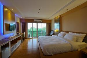 Ένα ή περισσότερα κρεβάτια σε δωμάτιο στο Kitlada Hotel Udonthani