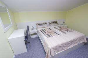 Ein Bett oder Betten in einem Zimmer der Unterkunft Guest House Katarina