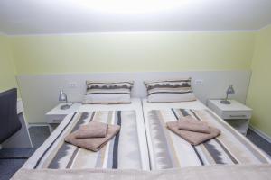 Ein Bett oder Betten in einem Zimmer der Unterkunft Guest House Katarina