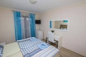 Ein Bett oder Betten in einem Zimmer der Unterkunft Guest House Katarina