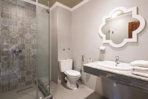 a bathroom with a toilet and a sink and a shower at Hotel Casablanca City Center in Casablanca