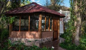 a gazebo in the middle of a garden at Eco Lodge Los Perales-Urubamba in Urubamba