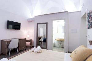 TV a/nebo společenská místnost v ubytování Le Stanze Del Duomo