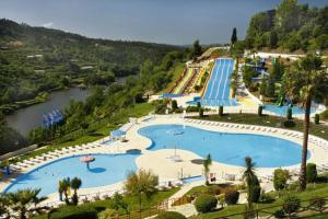 an overhead view of a large swimming pool at a resort at Prestige Apartment in Amarante