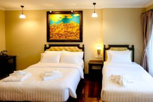 Posteľ alebo postele v izbe v ubytovaní Siri Heritage Bangkok Hotel