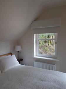 Station House Lanark Bed and Breakfast tesisinde bir odada yatak veya yataklar