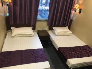 Postel nebo postele na pokoji v ubytování Kowloon YOUTH Village Tsim Sha Tsui 九龙青年公寓