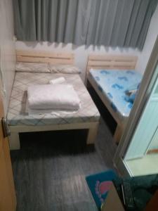 Voodi või voodid majutusasutuse Kowloon YOUTH Village Tsim Sha Tsui 九龙青年公寓 toas