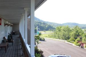 a view from the porch of a house with a road at Berkshire Travel Lodge in Canaan