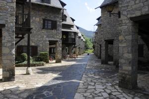 an alley in an old stone building at Alacran Home in Benasque