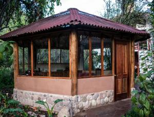 a small gazebo in a garden at Eco Lodge Los Perales-Urubamba in Urubamba