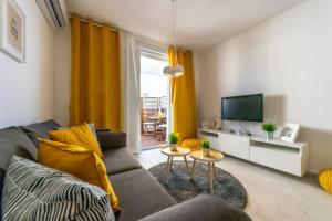 Televízia a/alebo spoločenská miestnosť v ubytovaní City apartment Marlo