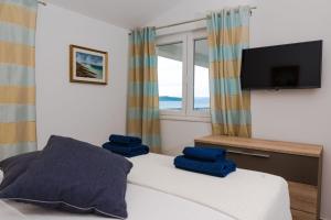 Posteľ alebo postele v izbe v ubytovaní Beachfront Apartments Don
