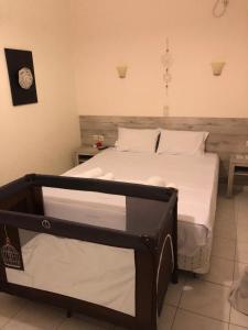 Postel nebo postele na pokoji v ubytování Iason Apartments