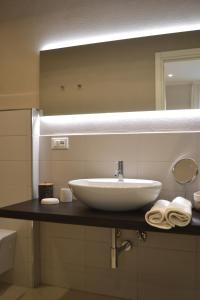 a bathroom with a sink and a large mirror at A Casa Mia in Levanto +37 photos
