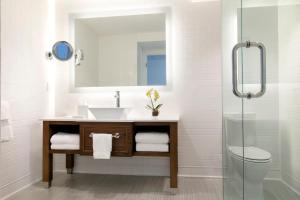 a bathroom with a sink, toilet, and bathtub at Oceans Edge Key West in Key West