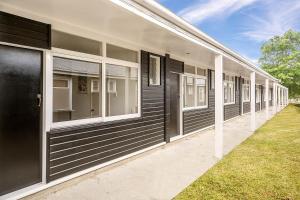 a row of windows on the side of a building at Waitaki Lakes Apartments - Otematata in Otematata