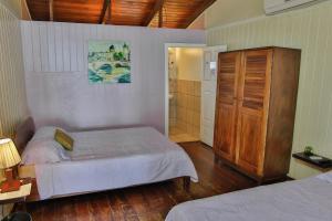 Voodi või voodid majutusasutuse Hotel Brasilito toas