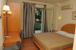 Posteľ alebo postele v izbe v ubytovaní Hotel Pantheon