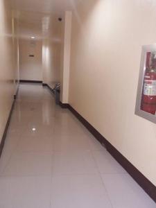 an empty hallway with a trash can in a building at Asia Novo Boutique Hotel - Catbalogan in Catbalogan