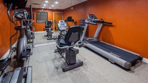 a gym with several exercise bikes and tread machines at Best Western Commerce Inn in Commerce