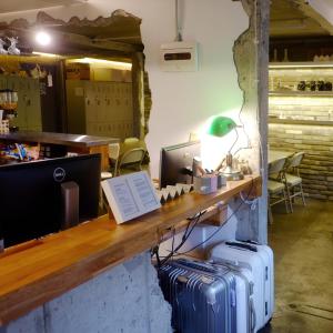 a counter with two suitcases sitting next to a desk at The Cube Hotel in Seoul