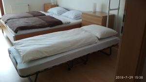 Posteľ alebo postele v izbe v ubytovaní Apartmán u golfu v Beskydech