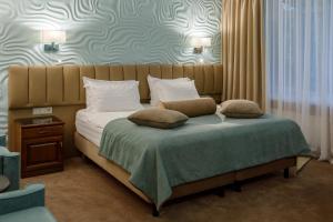 Кровать или кровати в номере Отель Брайтон