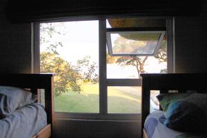 Кровать или кровати в номере The Wild Farm Backpackers