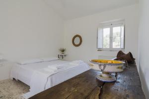 Postel nebo postele na pokoji v ubytování Agriturismo di Serragiumenta