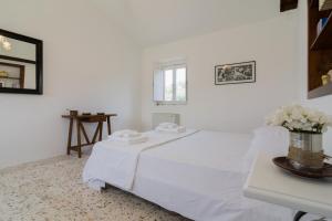 Postel nebo postele na pokoji v ubytování Agriturismo di Serragiumenta