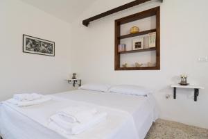 Postel nebo postele na pokoji v ubytování Agriturismo di Serragiumenta