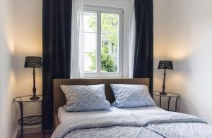 Un pat sau paturi într-o cameră la Seesterne City
