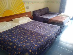 Postel nebo postele na pokoji v ubytování Sporting Baia Hotel