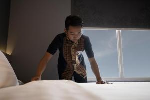 Katil atau katil-katil dalam bilik di BATIQA Hotel Darmo - Surabaya