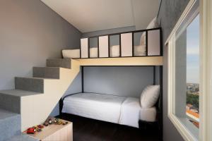 Katil atau katil-katil dalam bilik di BATIQA Hotel Darmo - Surabaya