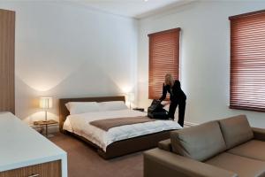 Postel nebo postele na pokoji v ubytování Ikon Hotel