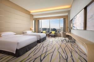 Fliport Wutong Hotel-Free Welcome Fruit & Near Exhibition Center 객실 침대