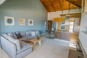 a living room with a couch and a table at Teatro Villa in Kato Rodini