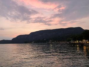 a view of a lake with mountains in the background at Appartamenti Villa Andrea in Garda