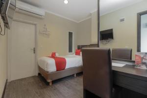 Ένα ή περισσότερα κρεβάτια σε δωμάτιο στο RedDoorz Plus @ Thamrin