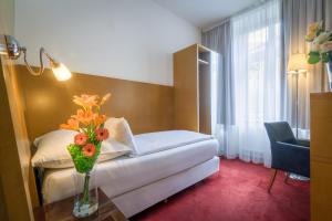 Posteľ alebo postele v izbe v ubytovaní Theatrino Hotel