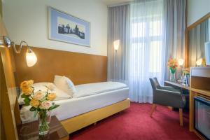Posteľ alebo postele v izbe v ubytovaní Theatrino Hotel