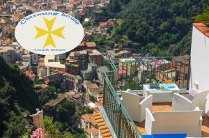 a view of a city from the balcony of a house at Amalfi Dream Charming House in Scala