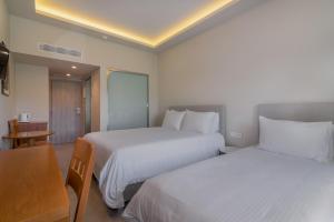 Postel nebo postele na pokoji v ubytování Hotel Palmyra