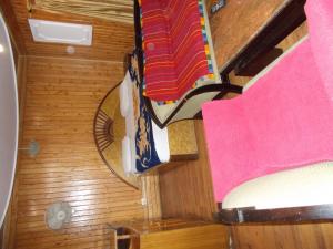 an overhead view of a room with a chair and a towel at Mall road Stay with In-house restaurant in Nainital