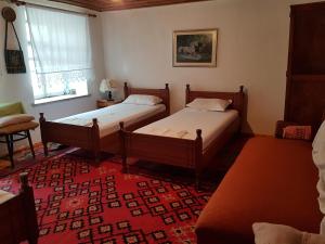 Postel nebo postele na pokoji v ubytování Eva Guesthouse + 24 fotografií