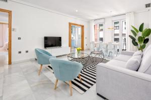 Televízia a/alebo spoločenská miestnosť v ubytovaní Apartamento Calle Martínez - Larios