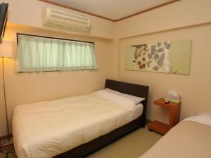 Postel nebo postele na pokoji v ubytování Hostel Zen