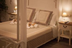 a bedroom with a bed with towels on it at Popolo & Flaminio Rooms in Rome